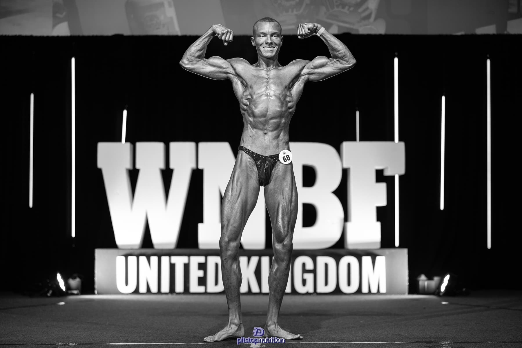 Oliver Blackwell on stage at the WNBF United Kingdom natural bodybuilding competition